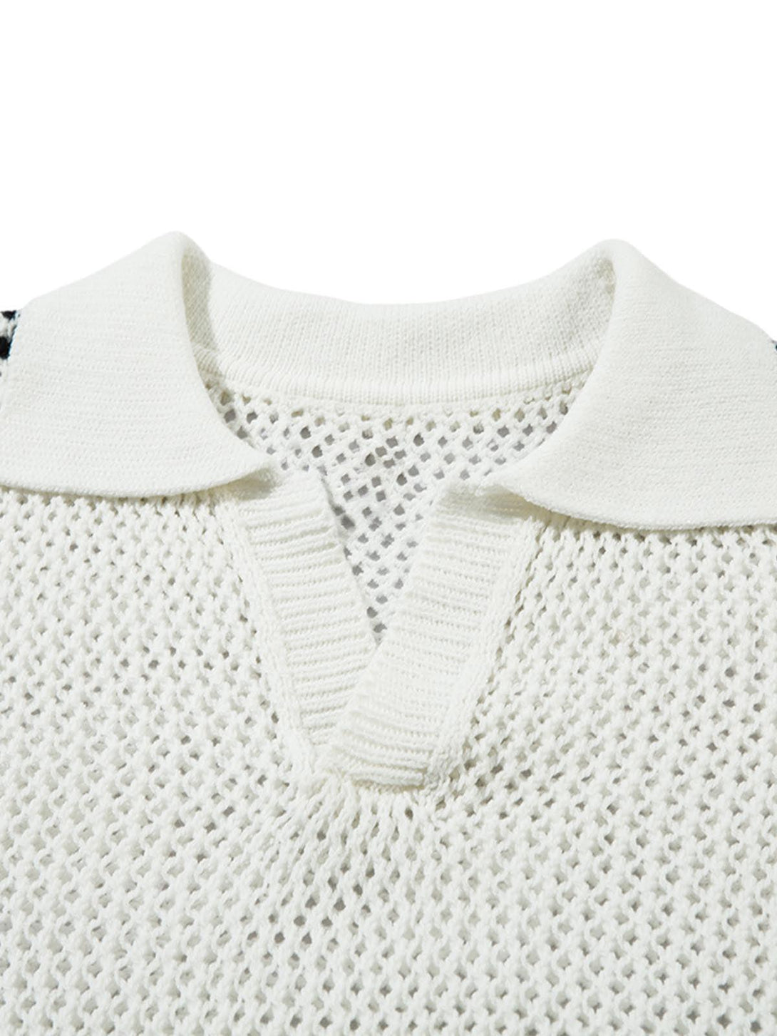 A close-up of TALISHKO's knitted polo sweater, highlighting its textured open-knit design.
