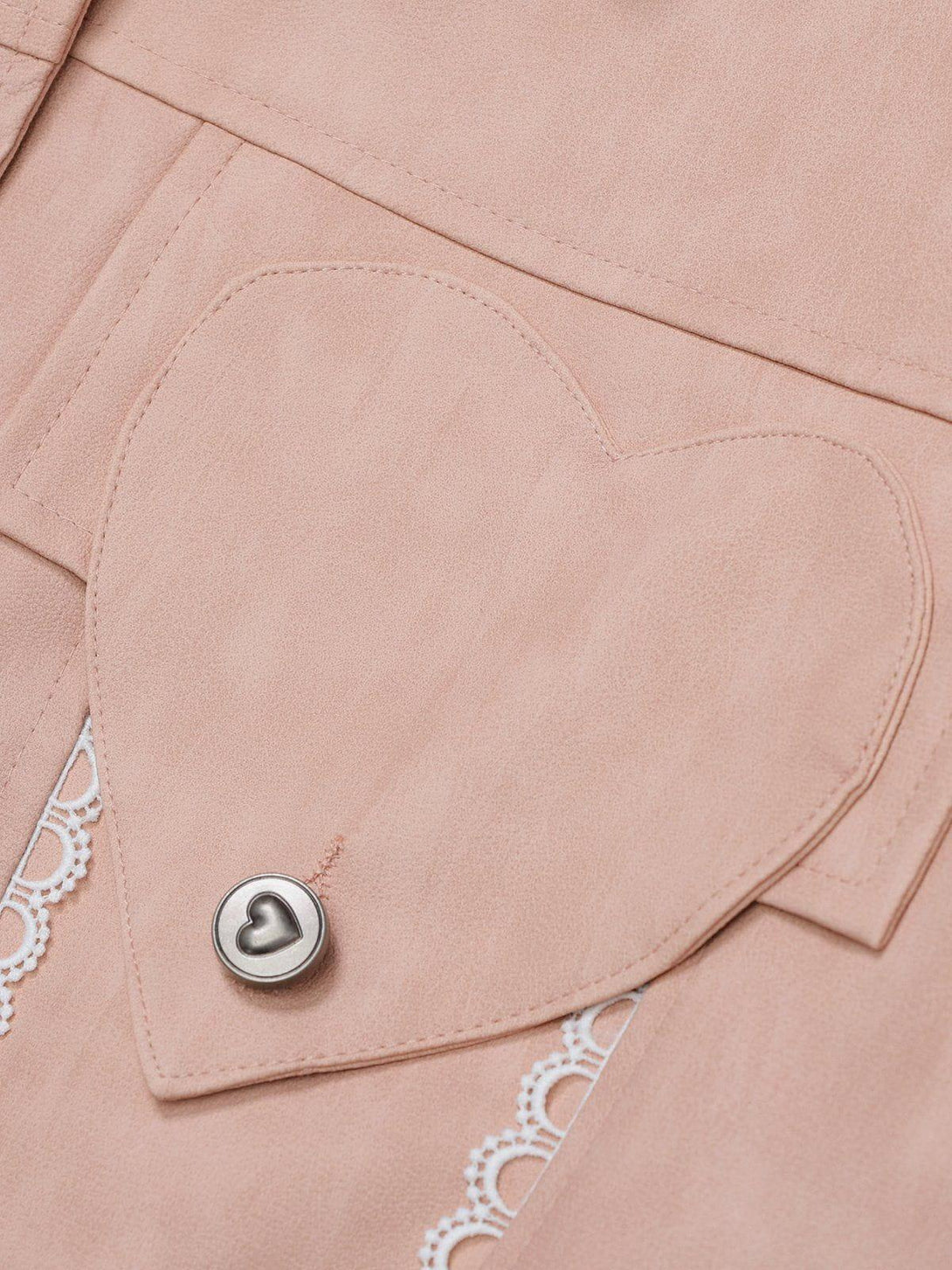 Heart-shaped pocket detail on TALISHKO's pink faux leather jacket with lace accents.