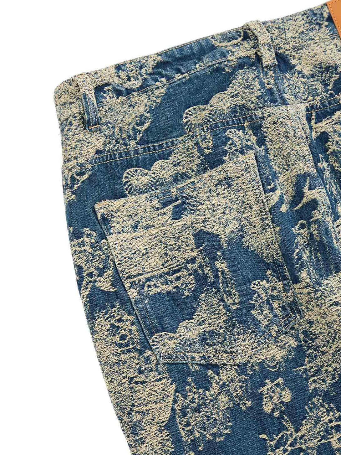 TALISHKO's straight jeans highlight a landscape jacquard pattern with detailed texture.