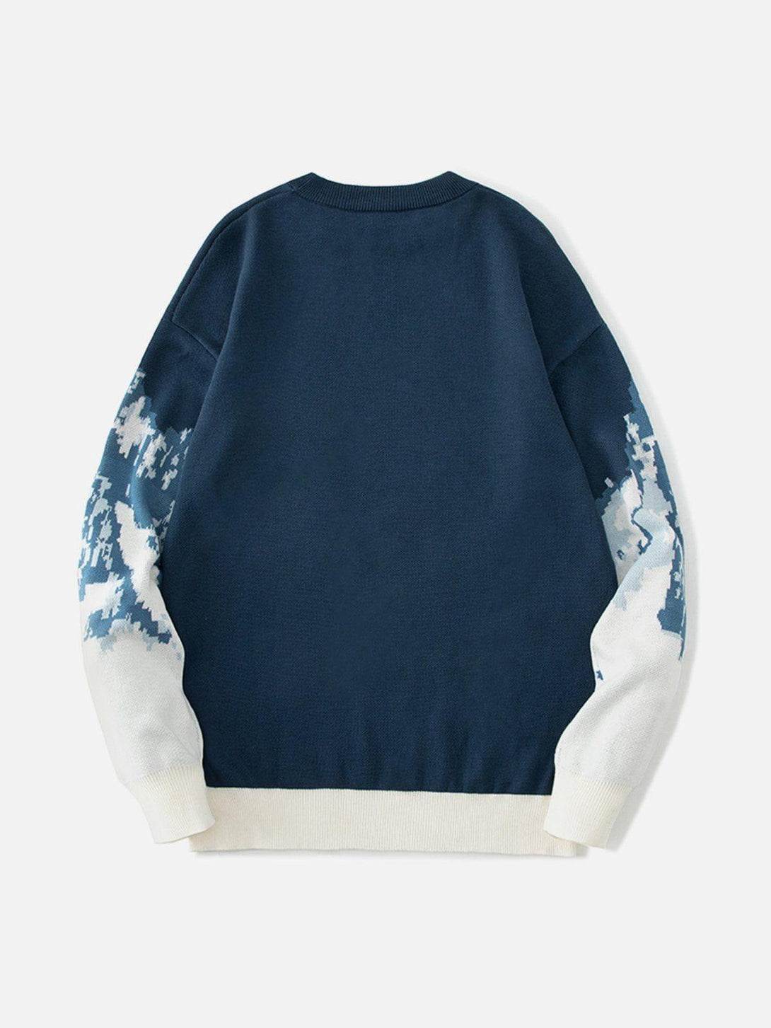 Back view of TALISHKO sweater in blue with snowy mountain jacquard pattern on sleeves.