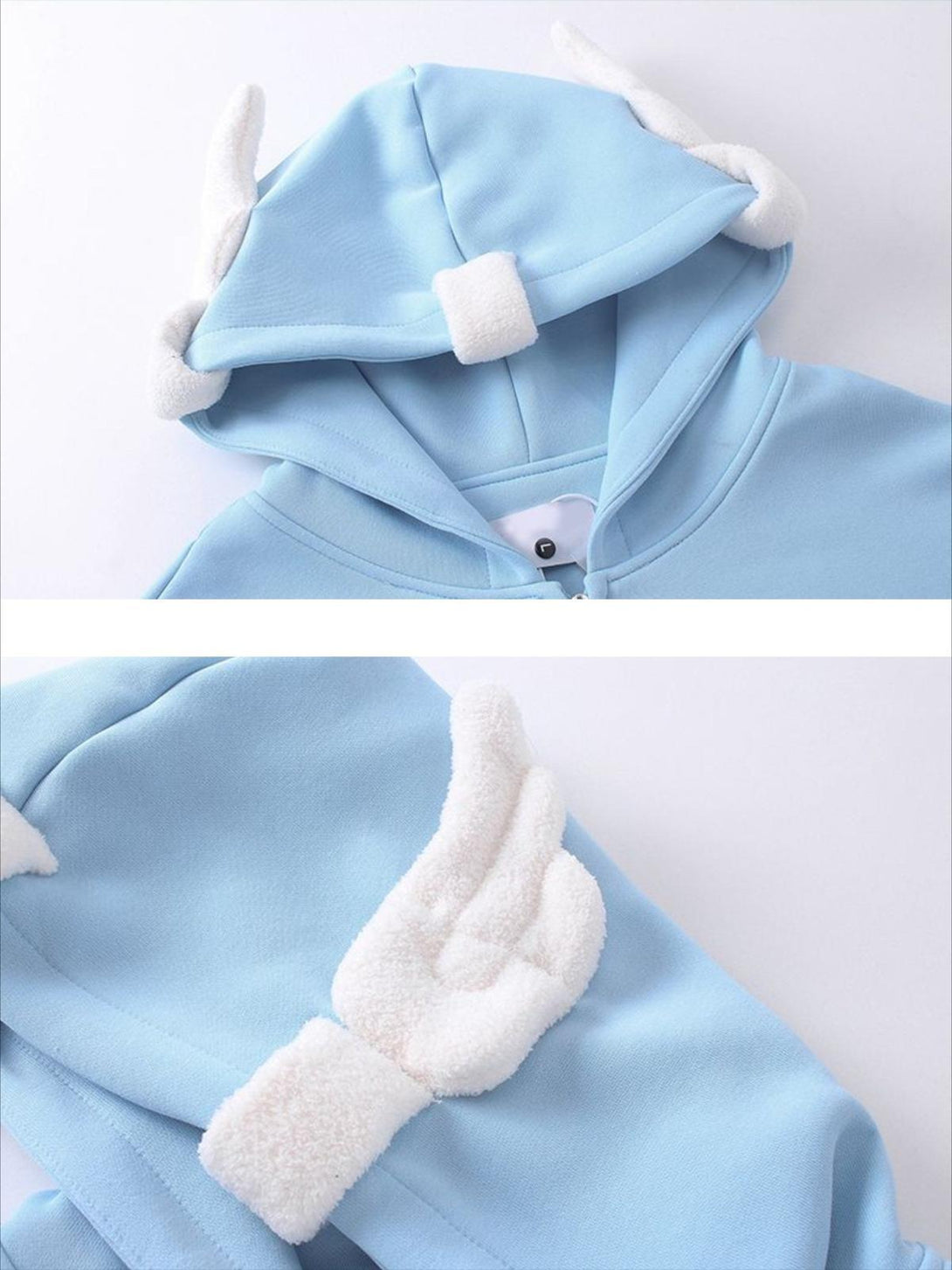 TALISHKO blue hoodie with angelic wing details on the hood, offering a whimsical charm.