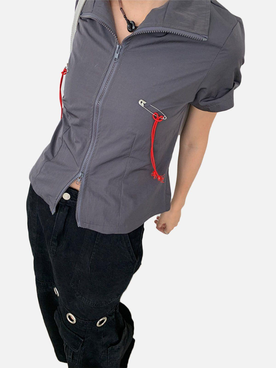 Model in gray TALISHKO tee with red drawstrings, paired with black cargo pants for a trendy vibe.