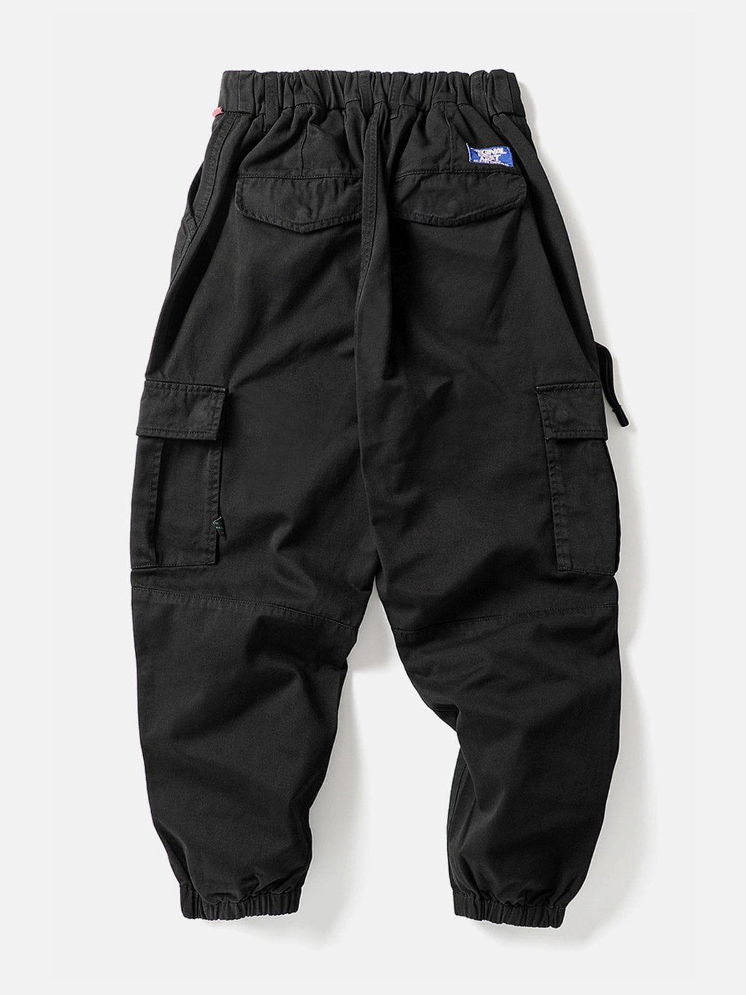 Back view of black cargo pants with elastic cuffs and pockets, designed by TALISHKO.