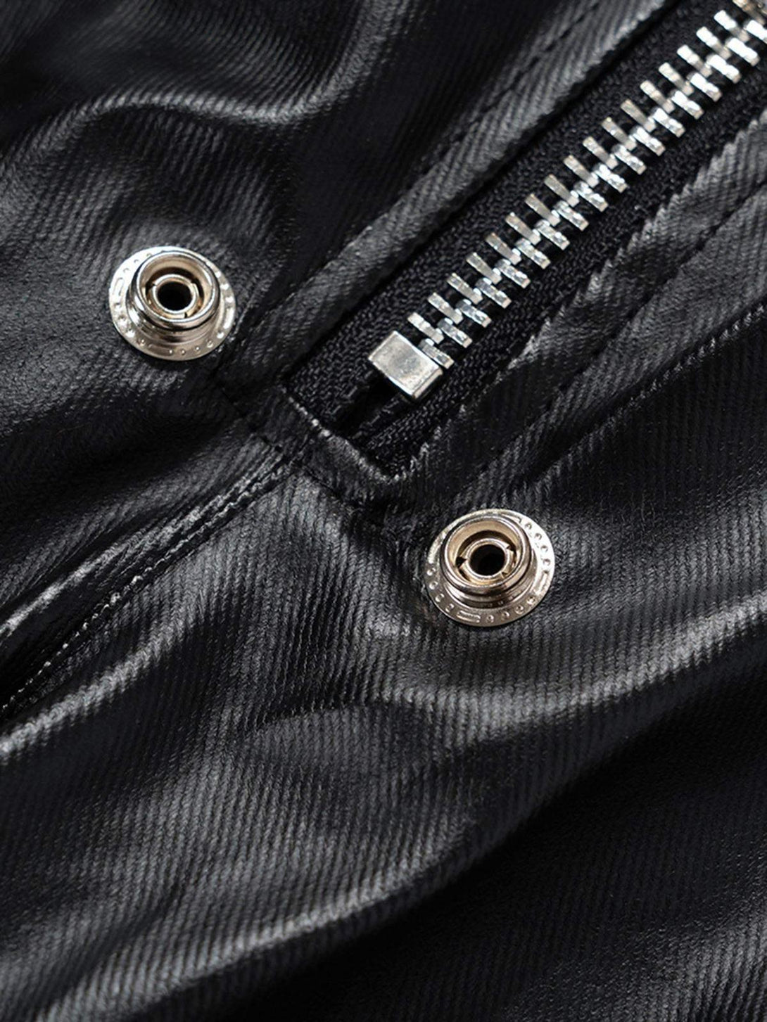 A detailed view highlighting the zipper and snap button design on TALISHKO's flared pants.
