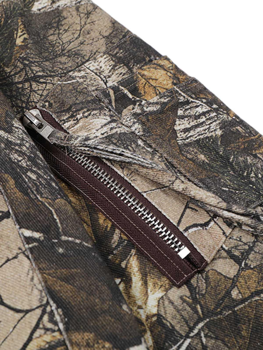 Zoomed-in view of TALISHKO bomber jacket pocket, highlighting leaf camouflage pattern.