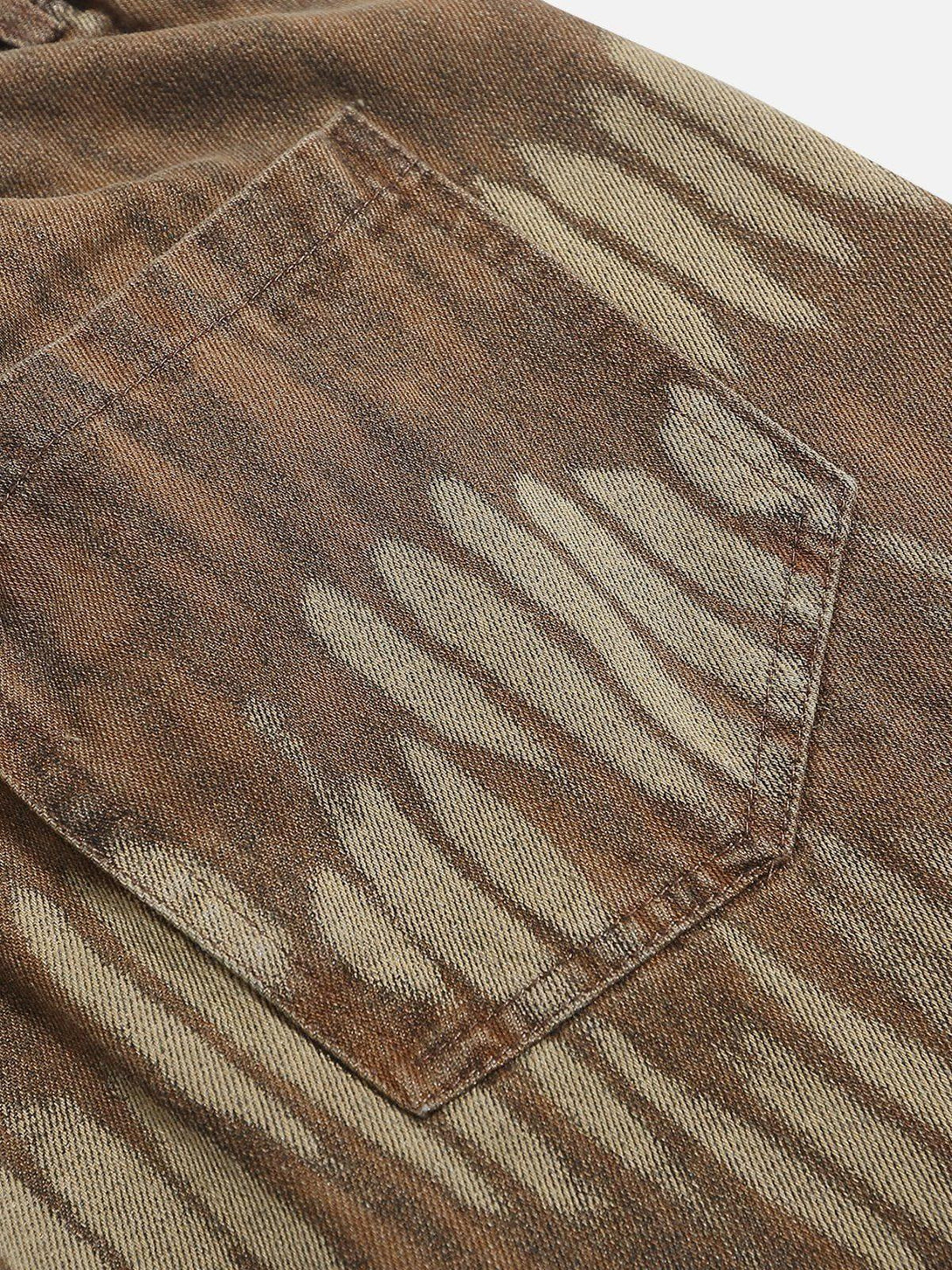 Texture and pattern showcased in TALISHKO's leaf pattern washed jorts, highlighting unique details.