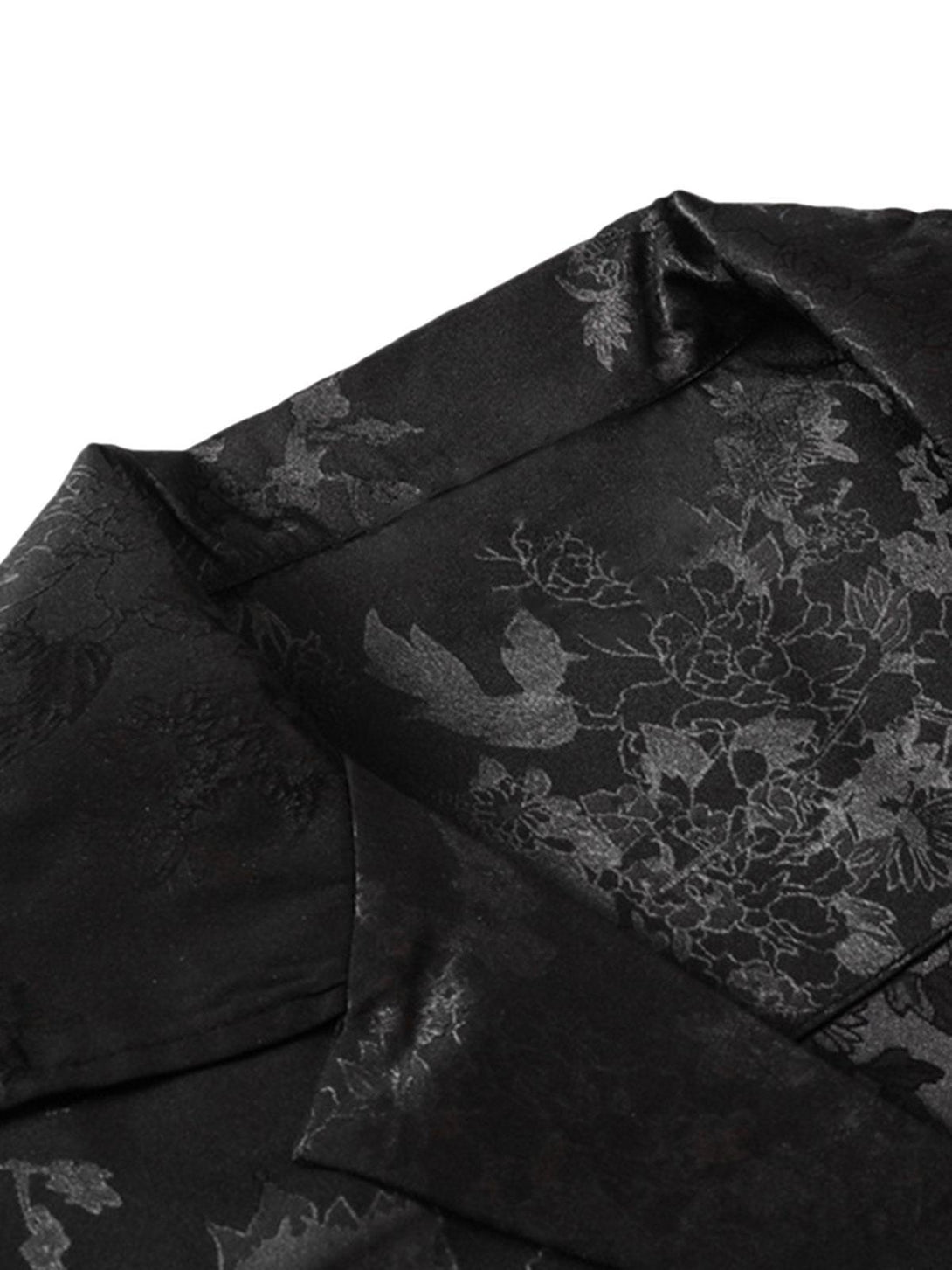 Intricate pattern detail of TALISHKO black vintage shirt, showcasing elegant leaf design.