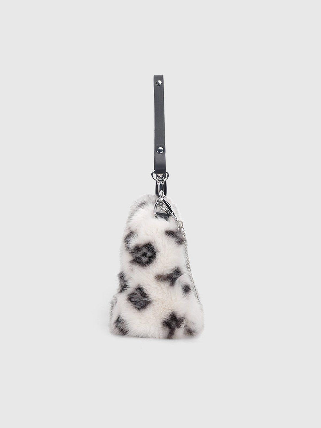 Side view of a leopard fleece chain bag by TALISHKO, highlighting its unique texture and style.