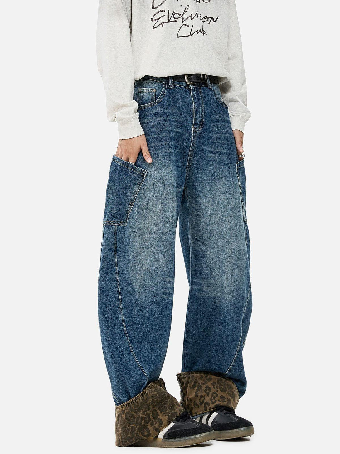 Model in TALISHKO jeans with leopard print cuffs, offering a bold and fashionable statement.