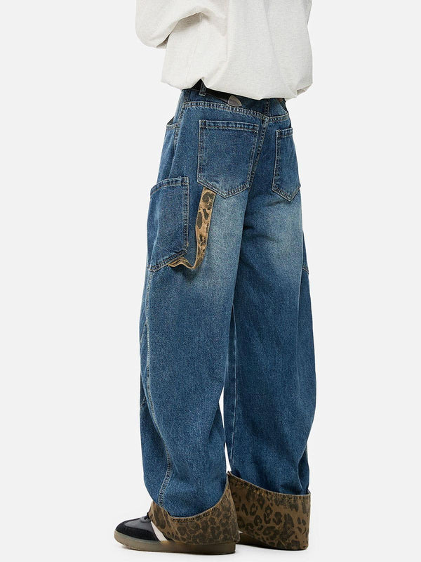 TALISHKO jeans with leopard print cuffs and loose fit, showcasing a unique and stylish design.