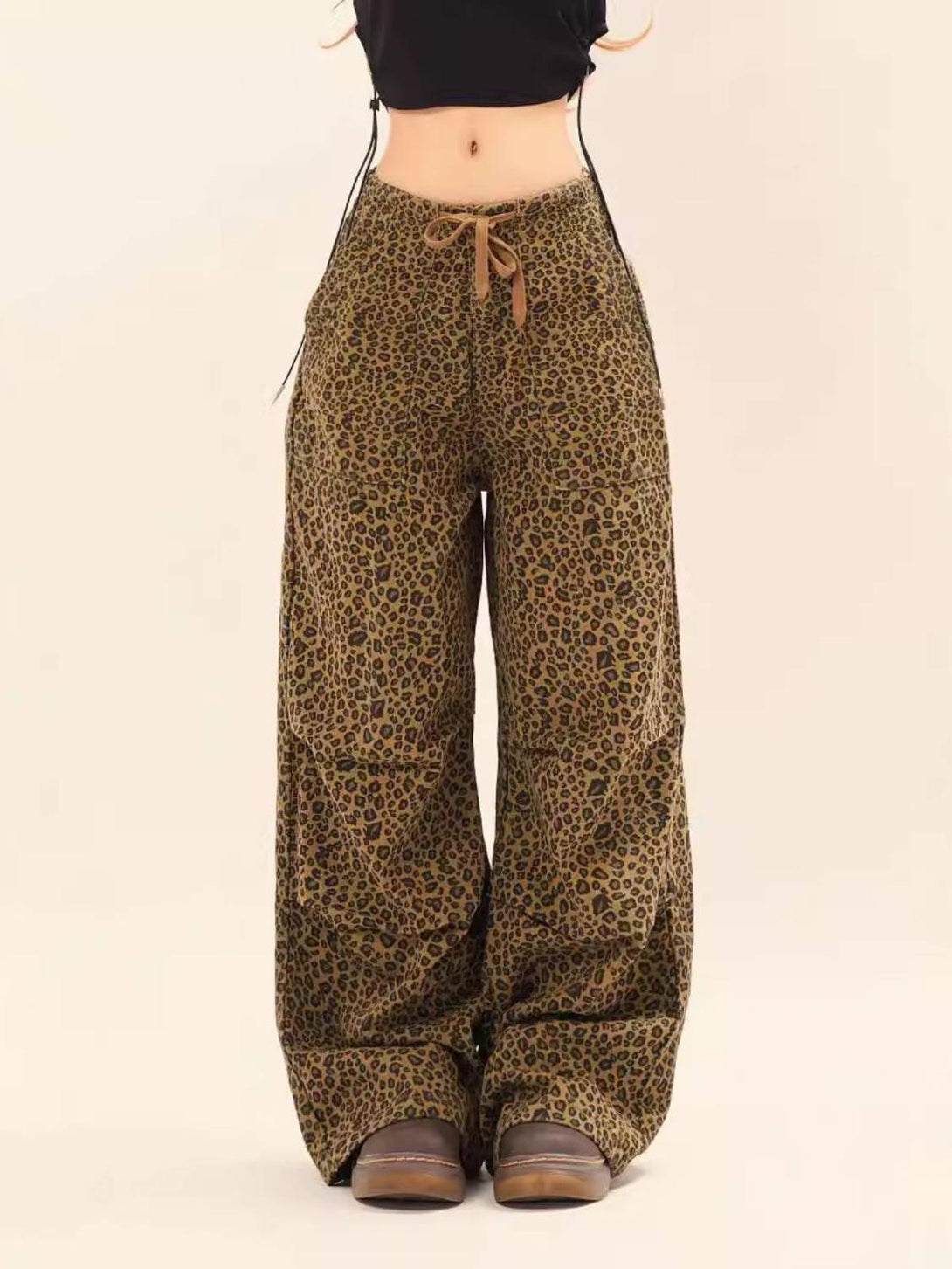 TALISHKO leopard print cargo pants with drawstring, modeled in a trendy wide-leg fit.