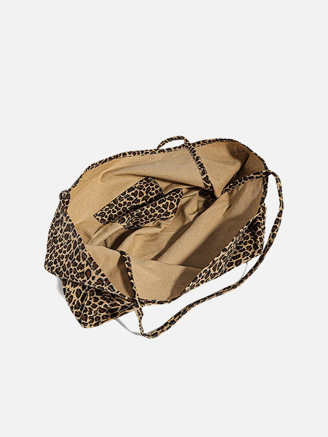 Open view of a leopard print tote bag by TALISHKO, showcasing its spacious interior and design.