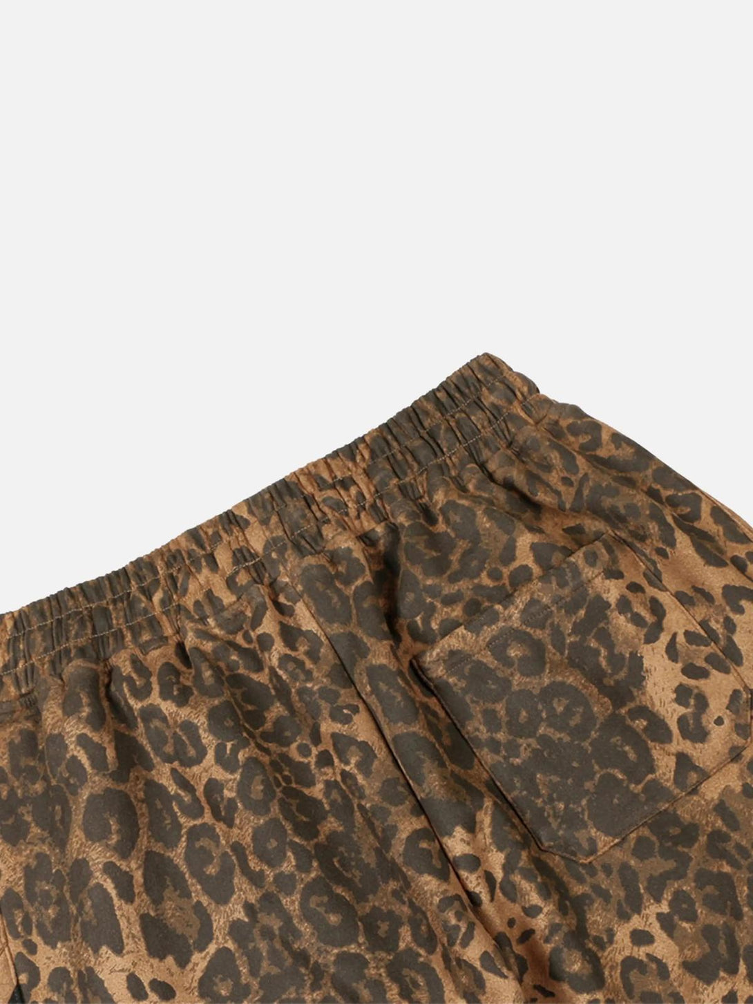 Intricate look at TALISHKO leopard stripe sweatpants, highlighting the bold print and design.