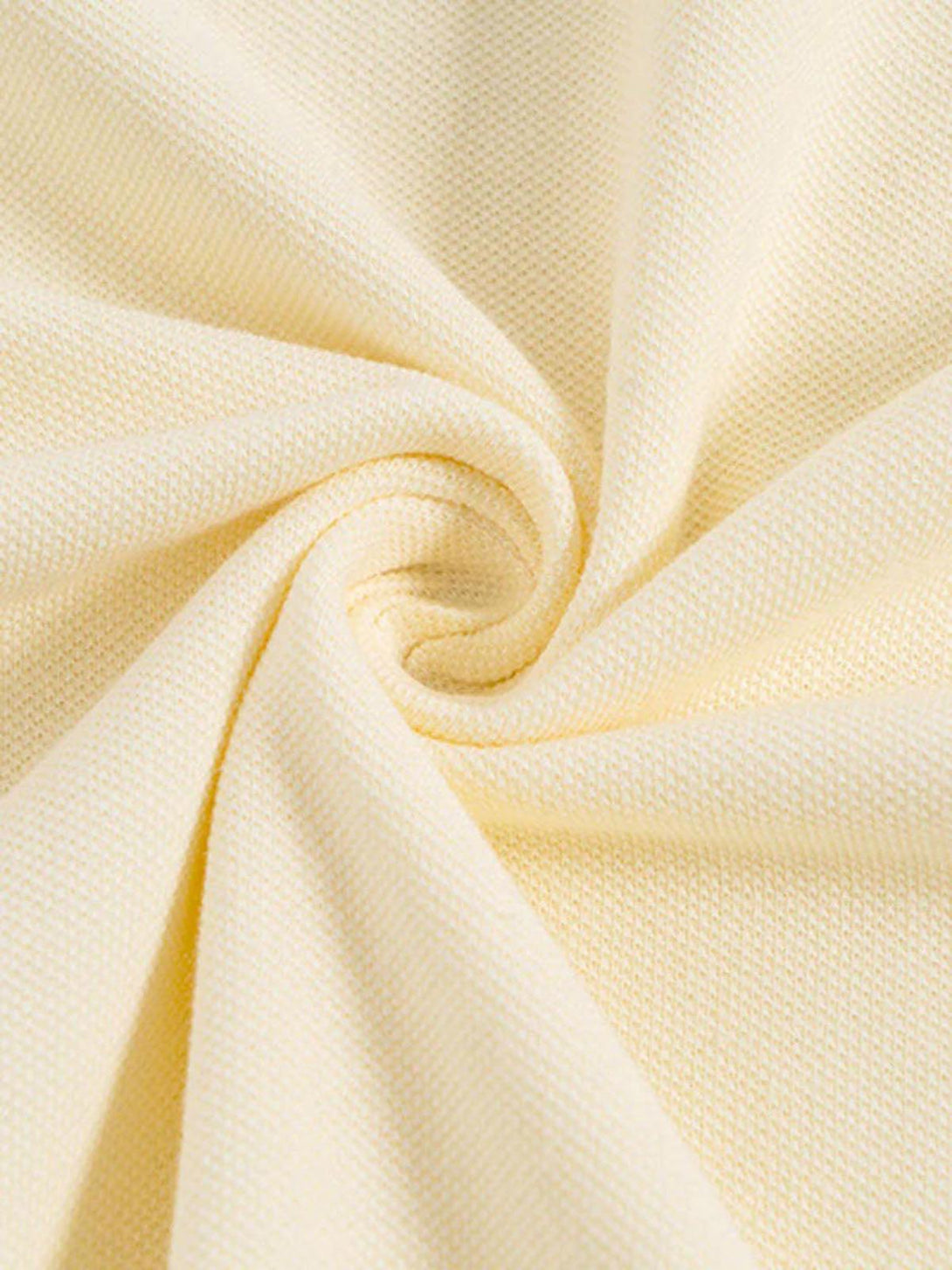 A close-up of TALISHKO's soft beige fabric, highlighting texture and quality craftsmanship.