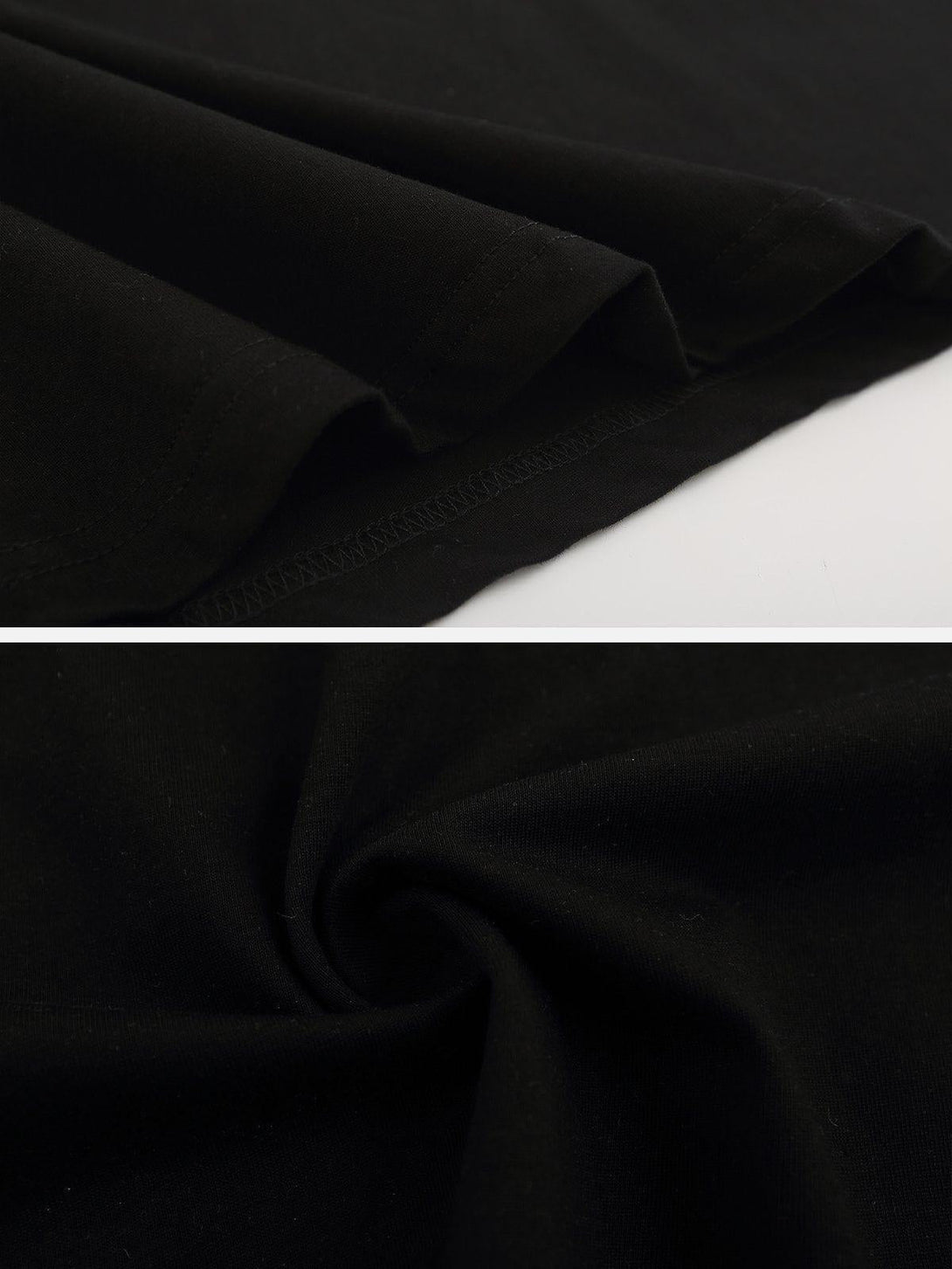 Detailed fabric and stitching of the black TALISHKO tee, highlighting its smooth texture.