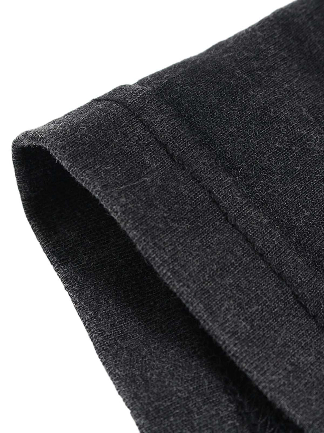 Intricate look at TALISHKO T-shirt's sleeve, highlighting textured dark fabric and stitching.