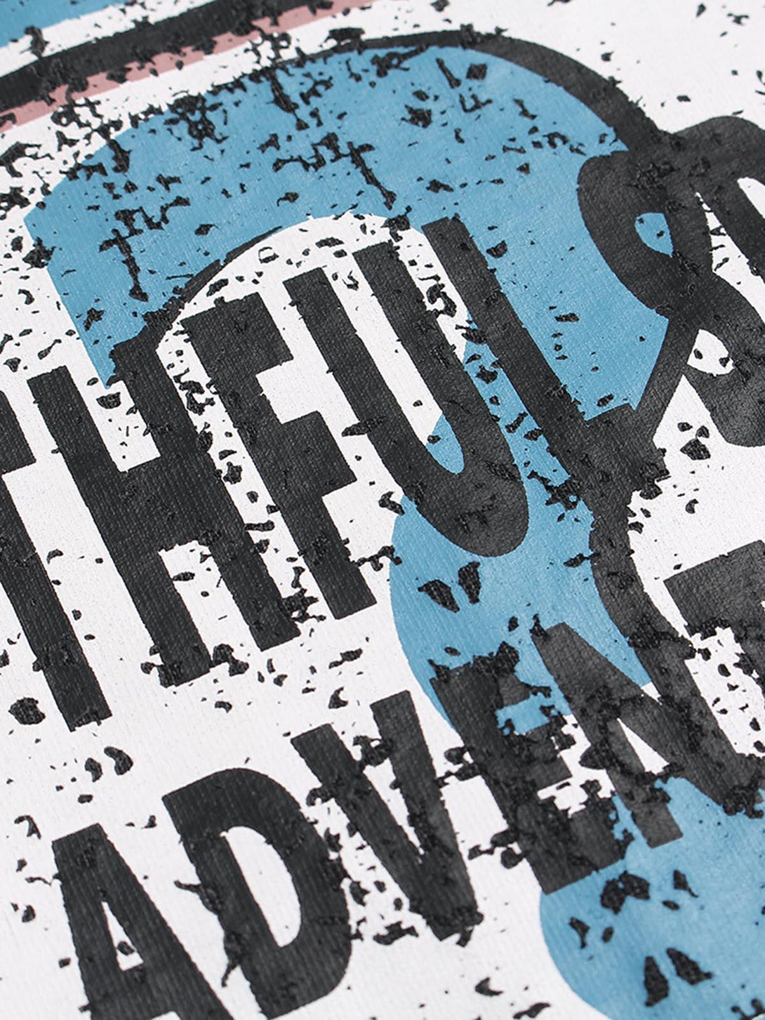 Zoomed-in detail of TALISHKO graphic crew-neck T-shirt, showcasing textured letter design.