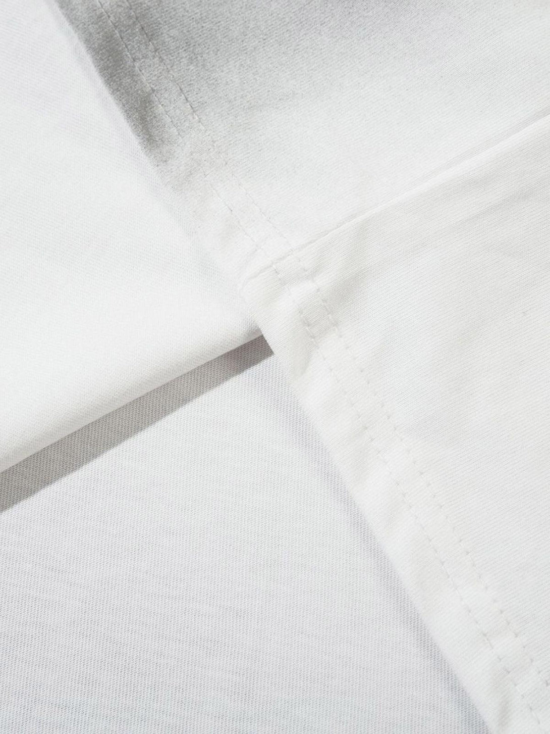 Detailed fabric and stitching of a gradient tank top by TALISHKO, showcasing subtle design elements.