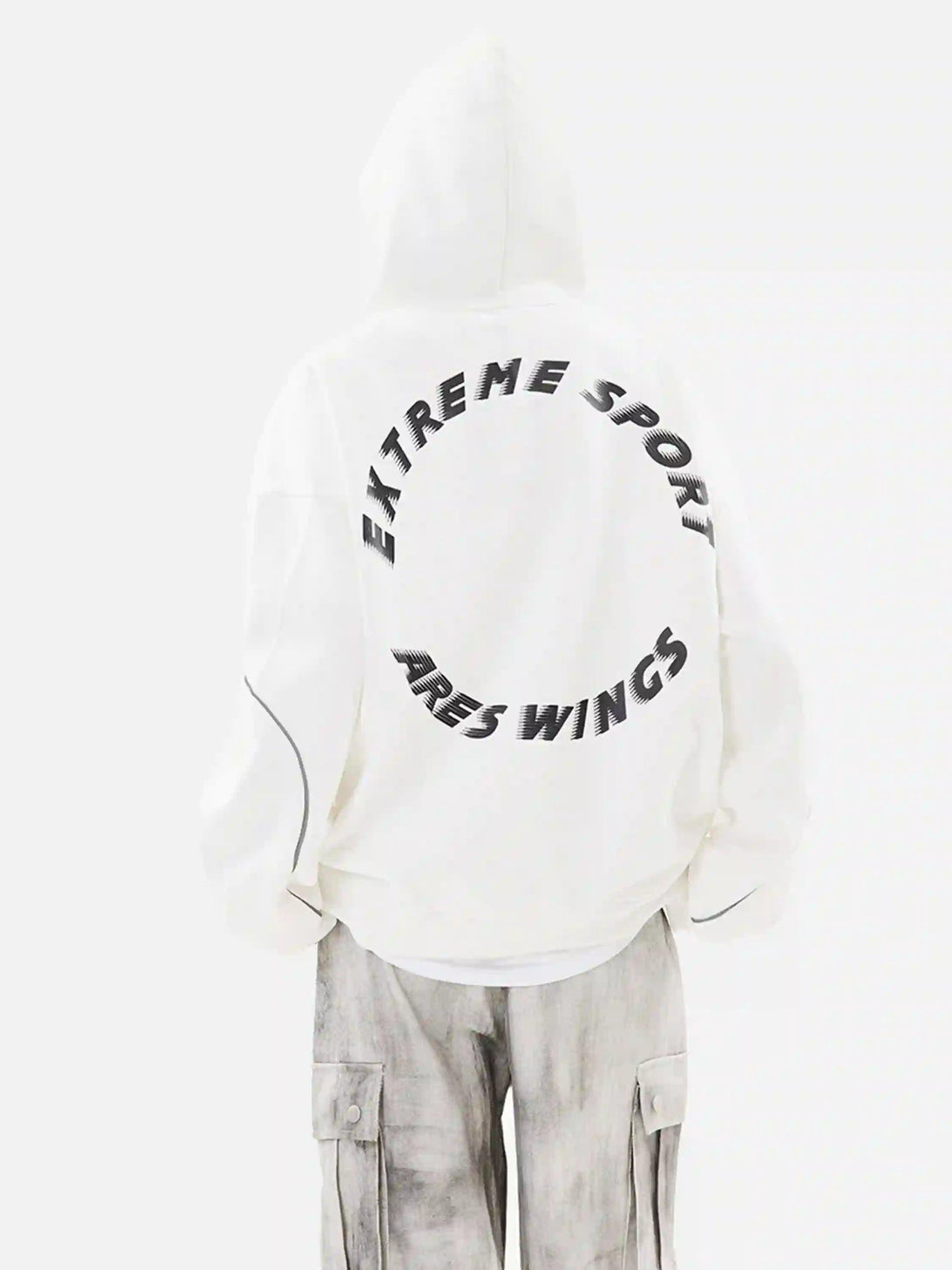 Back view of TALISHKO white hoodie with bold letter print, styled with cargo pants.