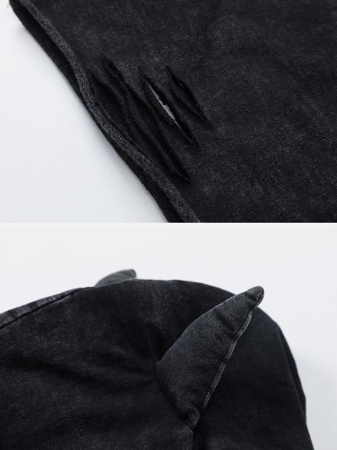 Intricate look at the black hooded tee by TALISHKO, showcasing ripped details and devil horns.