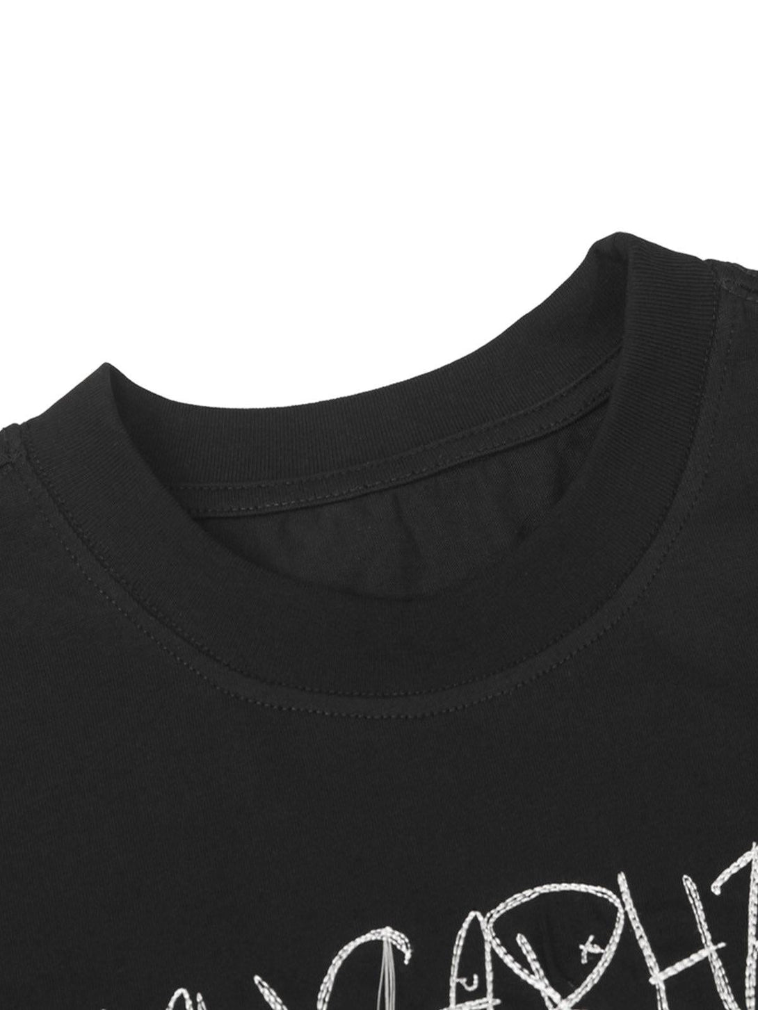 Intricate look at TALISHKO black T-shirt neckline with bold letter print detail.