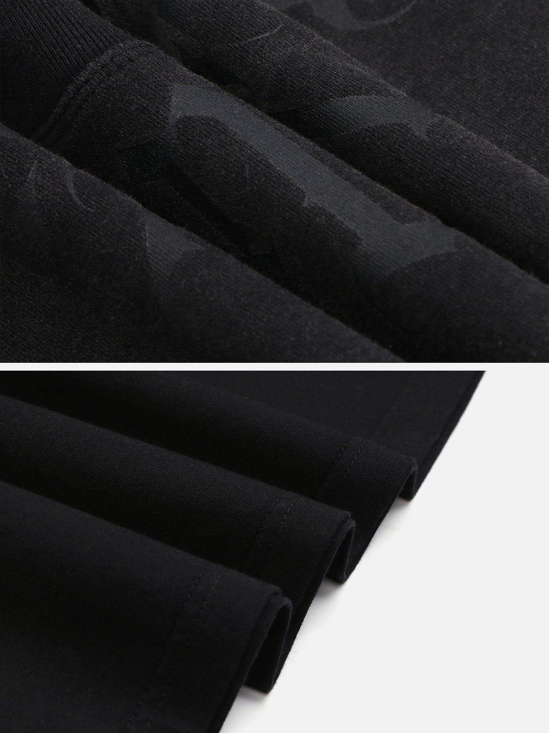 Detailed look at TALISHKO's black tee fabric and stitching, highlighting quality craftsmanship.
