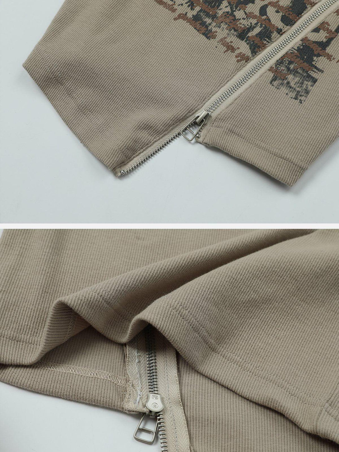 Intricate look at the zipper detail on a letter-print tee by TALISHKO, highlighting texture.