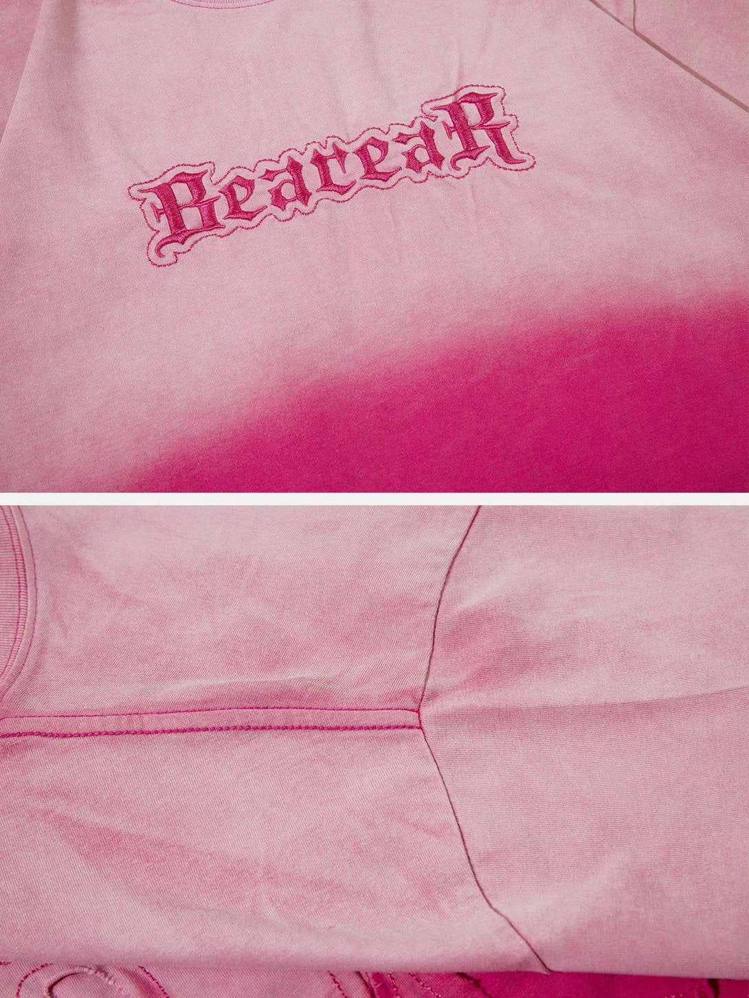 A detailed view of the pink TALISHKO vintage tee, highlighting the bold letters graphic design.