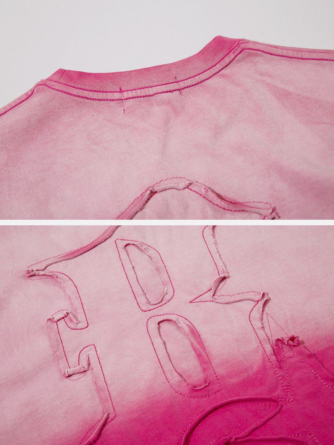 Intricate look at the reverse stitching on the pink TALISHKO vintage tee, highlighting unique details.