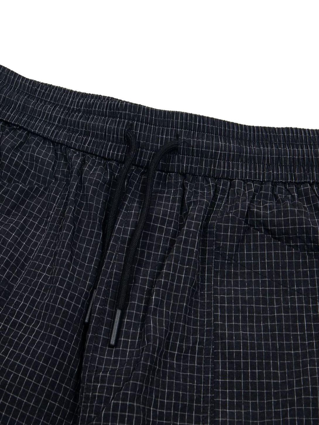 A detailed look at TALISHKO quick-dry cargo shorts with a checkered drawstring waist.