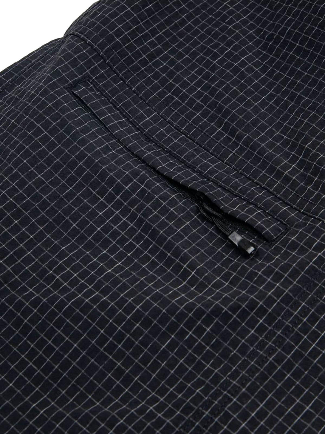 Detailed fabric view of TALISHKO light quick-dry cargo shorts, featuring a checkered design.