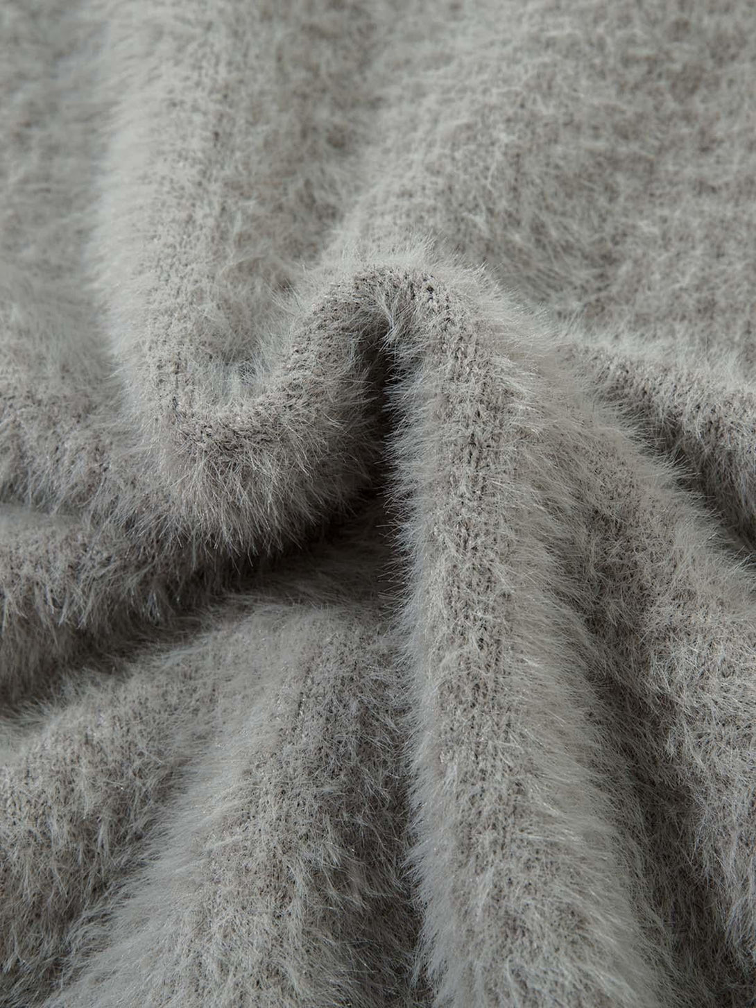 Zoomed-in texture of TALISHKO's imitation mink fur sweater, highlighting its soft, fuzzy detail.