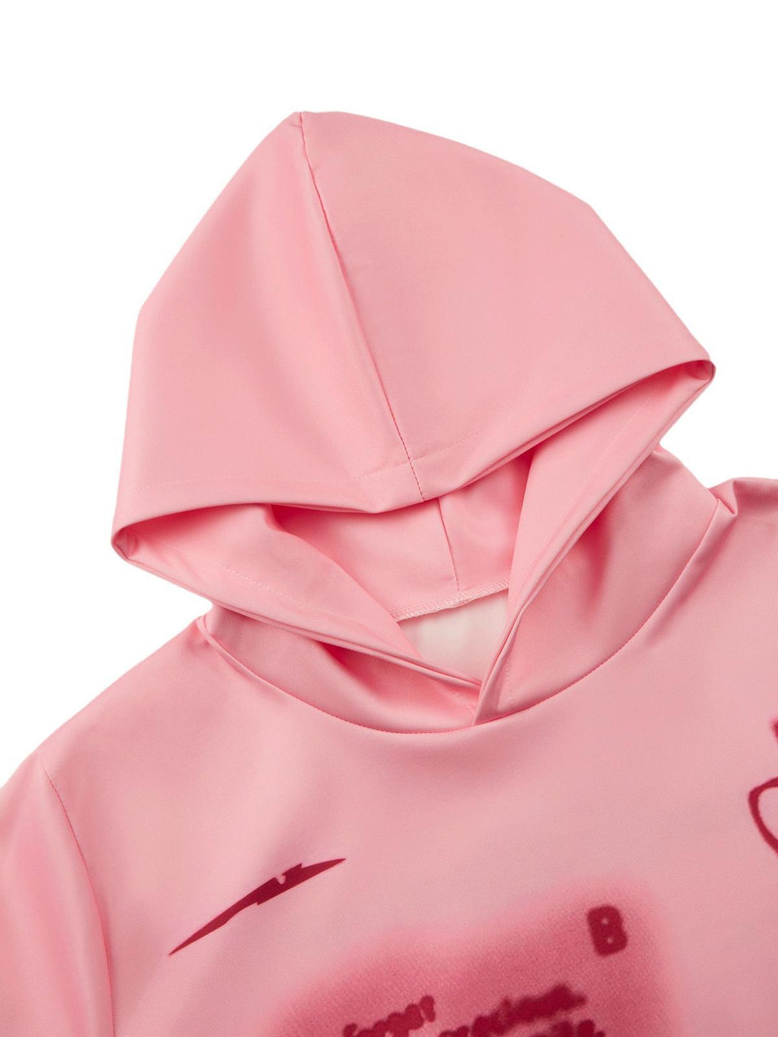 Focusing on the soft pink fabric and hood detail of the TALISHKO character hoodie.