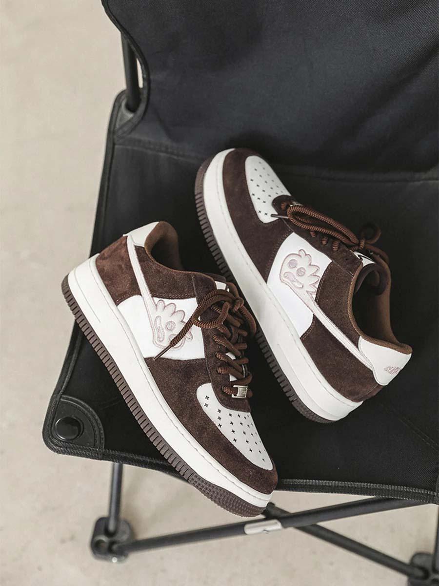 TALISHKO sneakers in brown and white on a chair, highlighting playful design details.