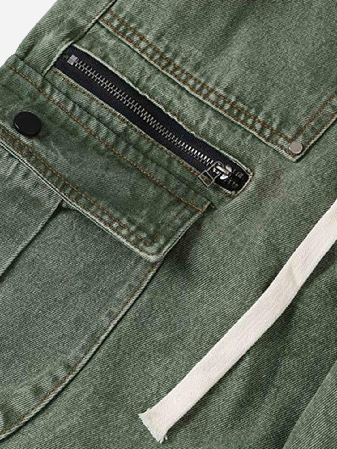 A close-up of TALISHKO's loose straight casual work pants, focusing on the pocket zipper detail.