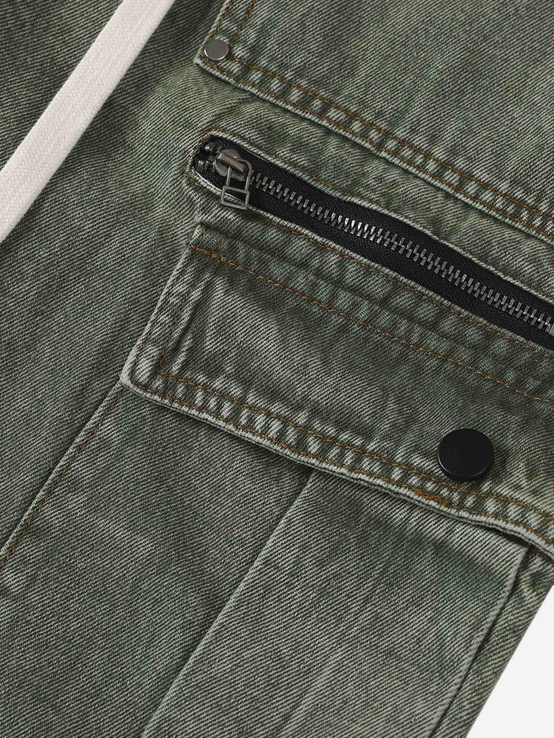 Intricate look at TALISHKO's work pants, highlighting the pocket zipper and button detail.