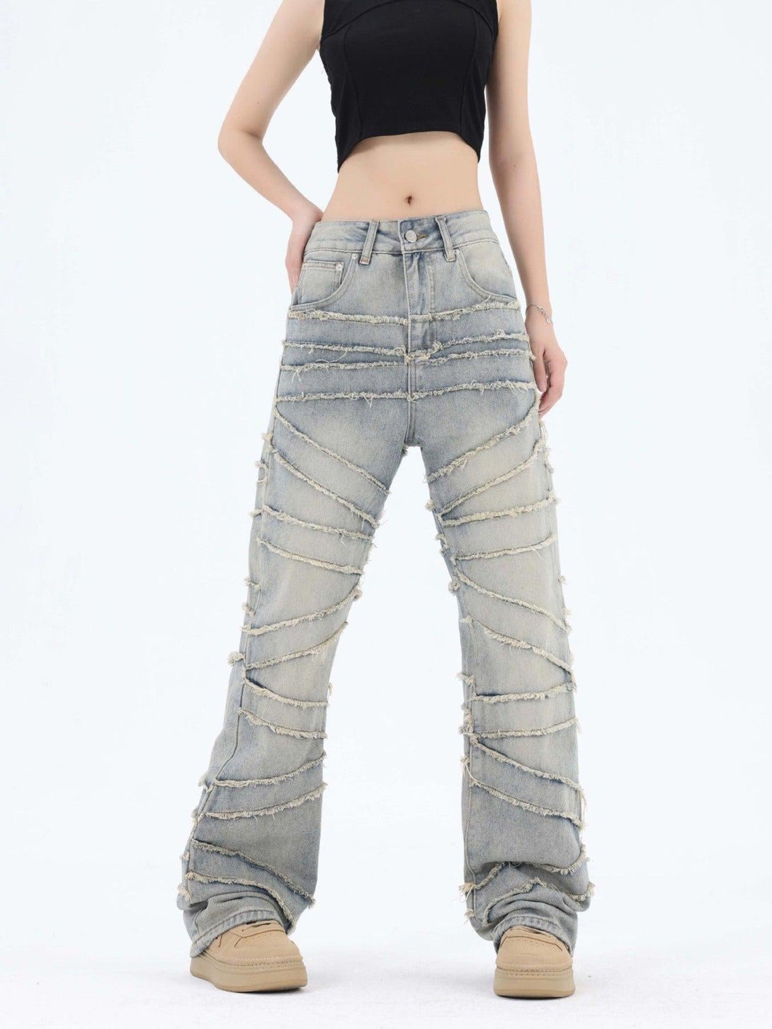 Model in TALISHKO jeans with frayed diagonal stripes, featuring a stylish wide-leg fit.
