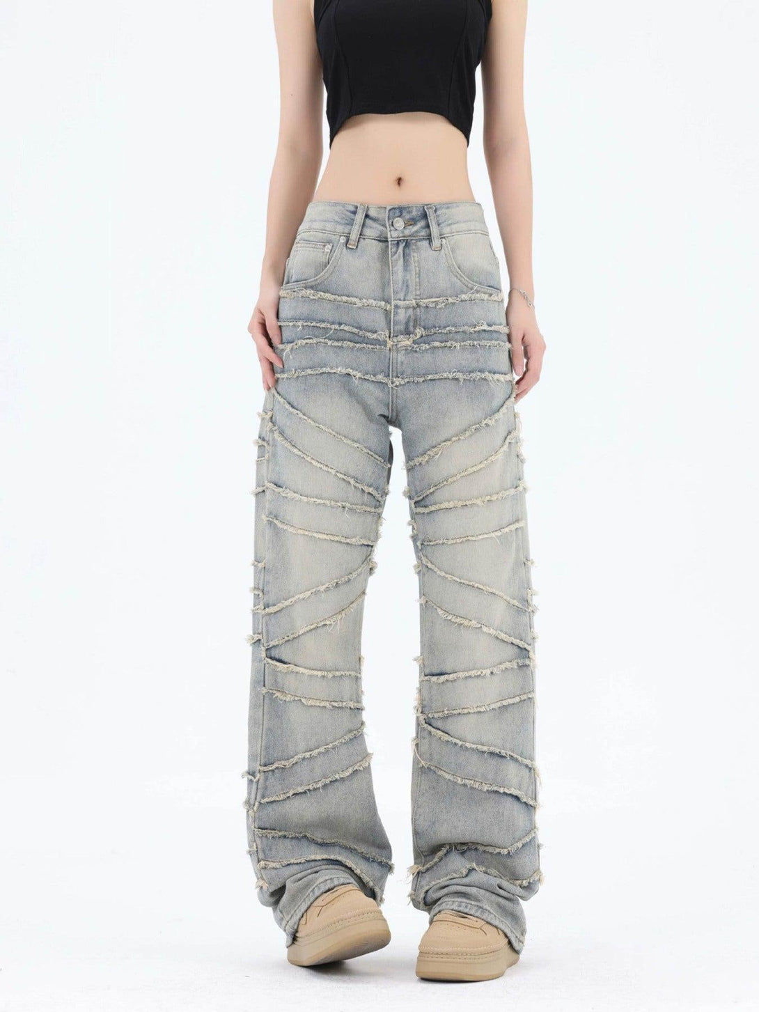 Model wearing TALISHKO loose wide-leg jeans with unique frayed detailing for a trendy look.
