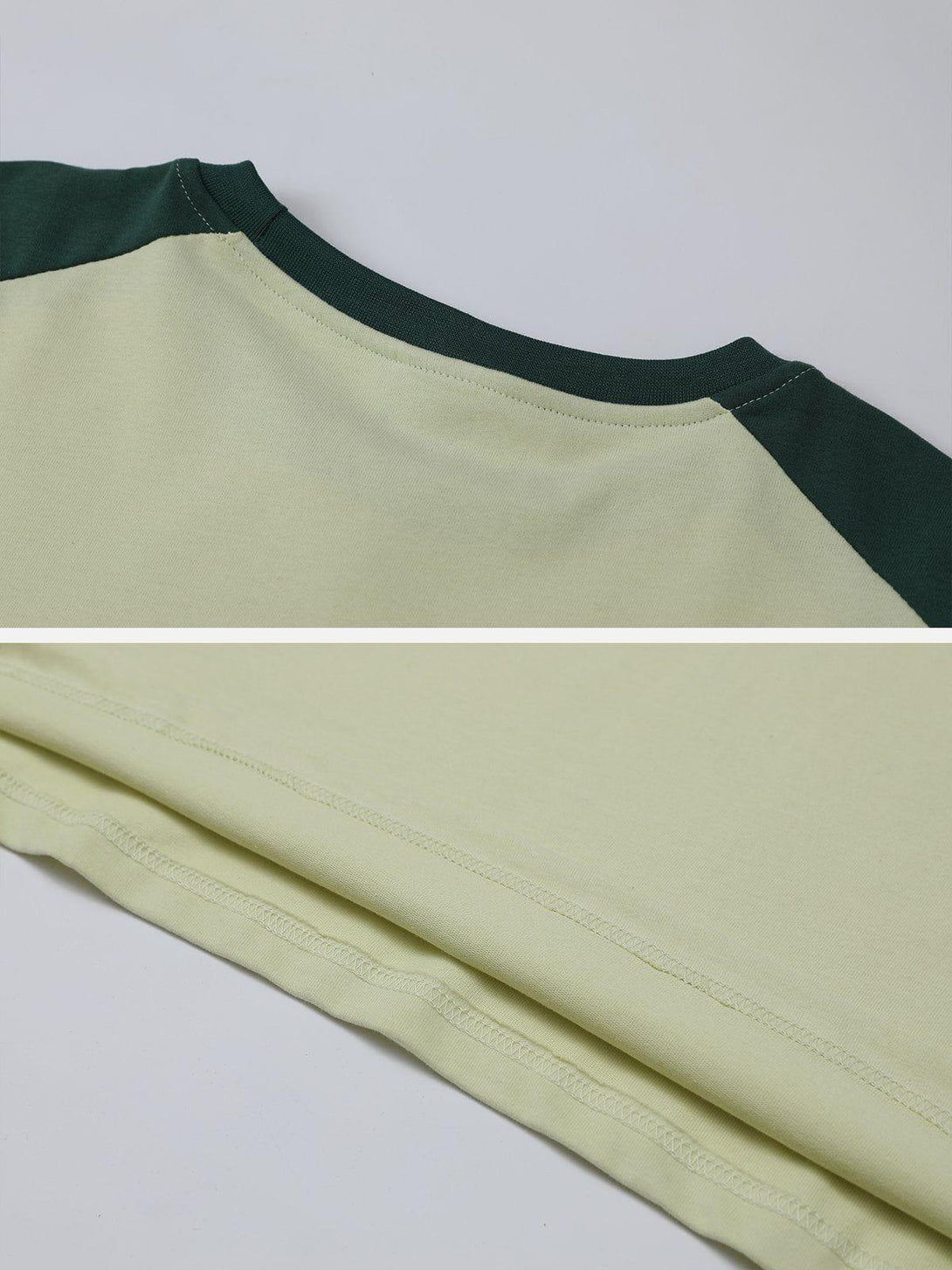 Detailed fabric and stitching on TALISHKO's patchwork tee, highlighting unique design elements.