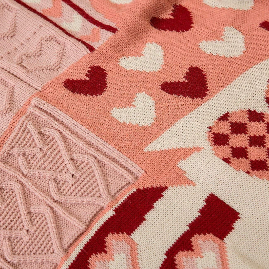 Intricate look at heart patterns on the knit sweater by TALISHKO, highlighting cozy details.