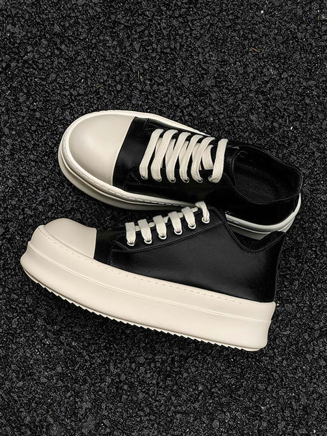 TALISHKO's chunky low-top sneakers in black with cream accents, offering a stylish urban vibe.