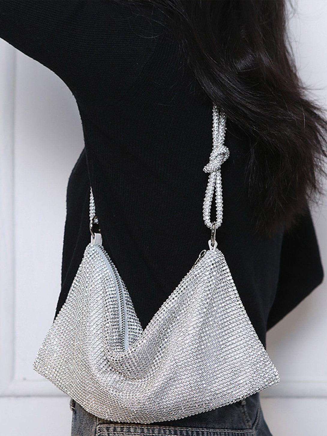 TALISHKO luxury diamond bag draped on shoulder, highlighting its shimmering design.