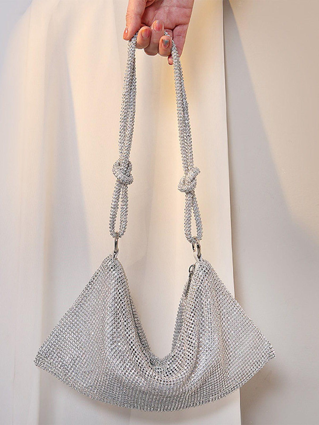 TALISHKO luxury diamond bag held by hand, showcasing its sparkling and elegant design.