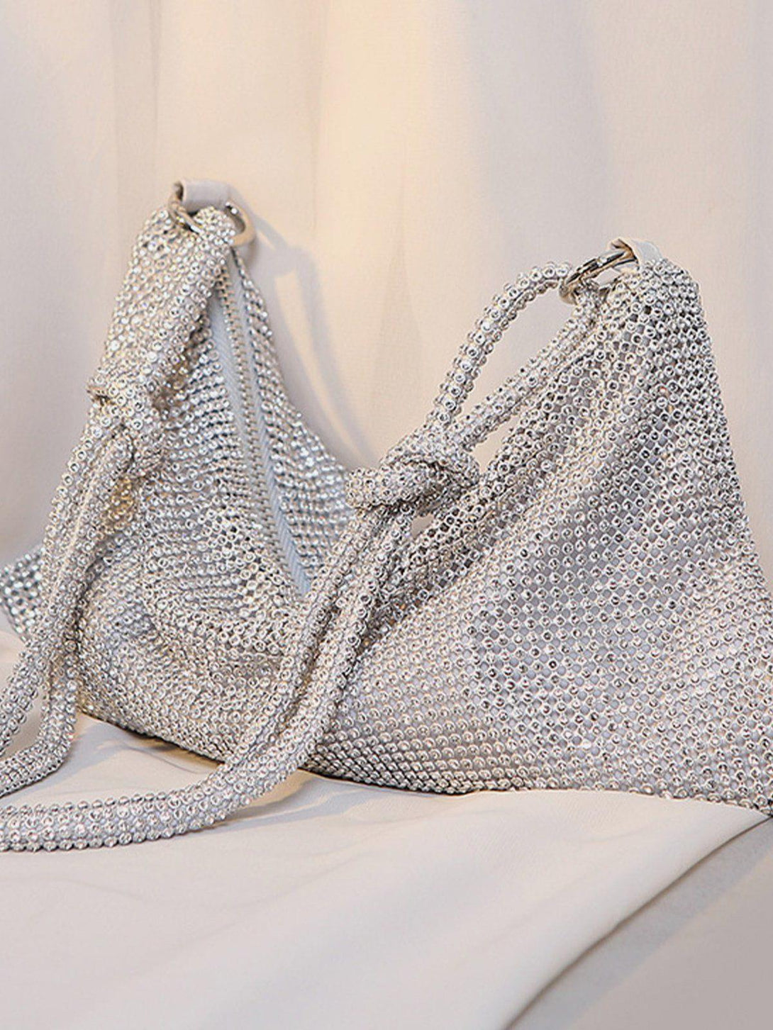 TALISHKO luxury diamond bag in silver, side view, highlighting its sparkling crystal texture.