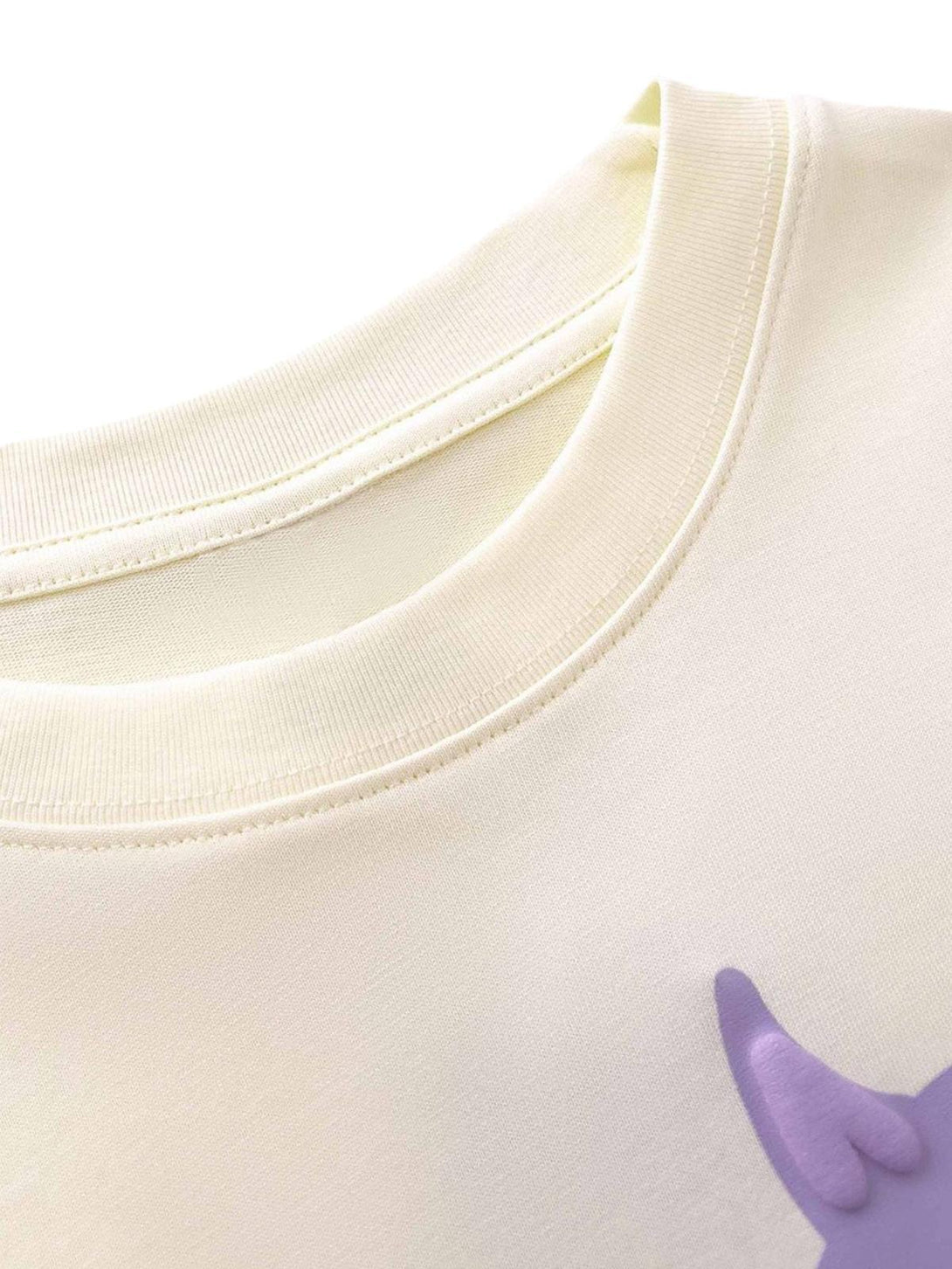 Intricate look at the neckline of a TALISHKO T-shirt, highlighting soft fabric and stitching.