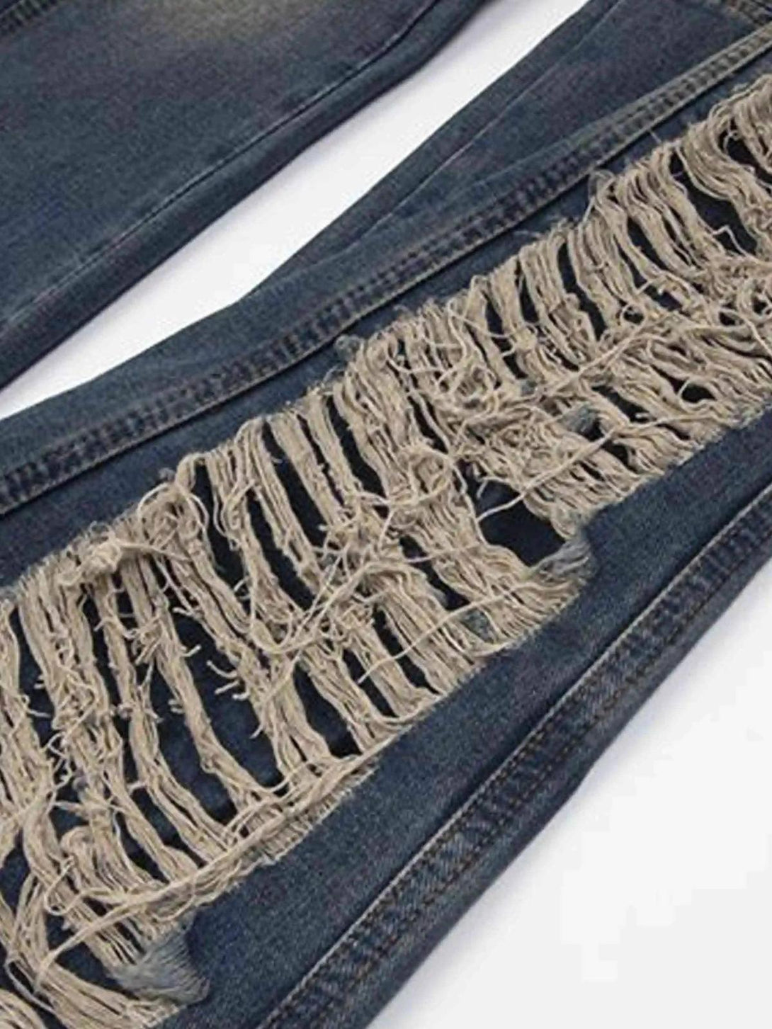 Intricate look at the frayed detailing on TALISHKO Maillard Hottie Ripped Jeans.