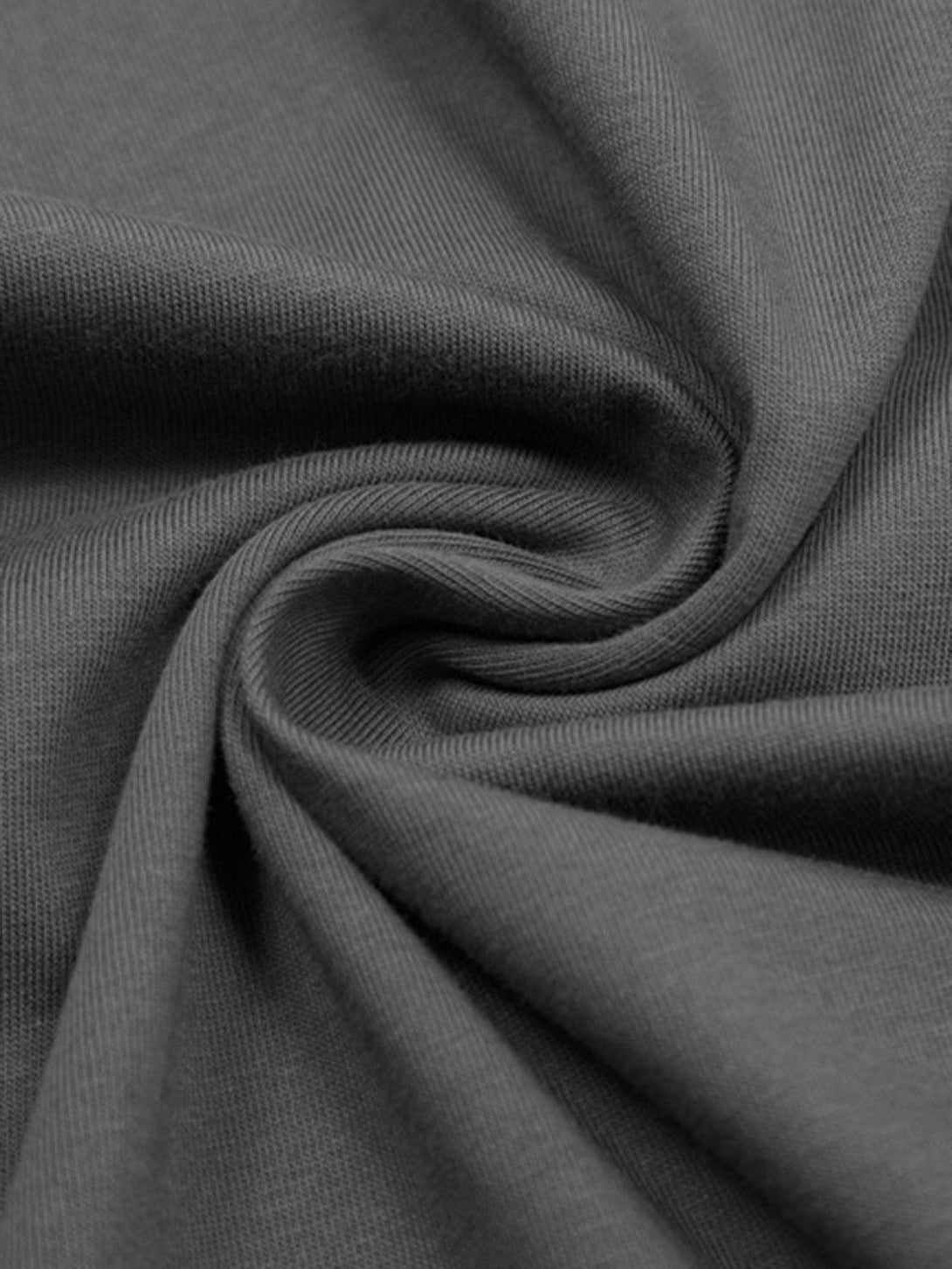 A tight crop highlighting the smooth texture of TALISHKO's graphic T-shirt fabric.