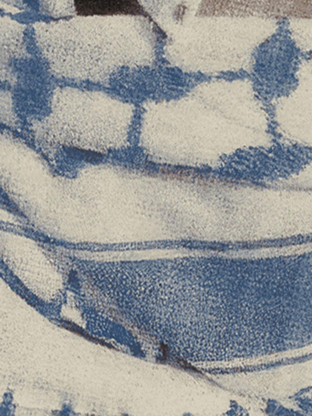 Zoomed-in texture of TALISHKO's graphic T-shirt, showcasing a masked portrait design.