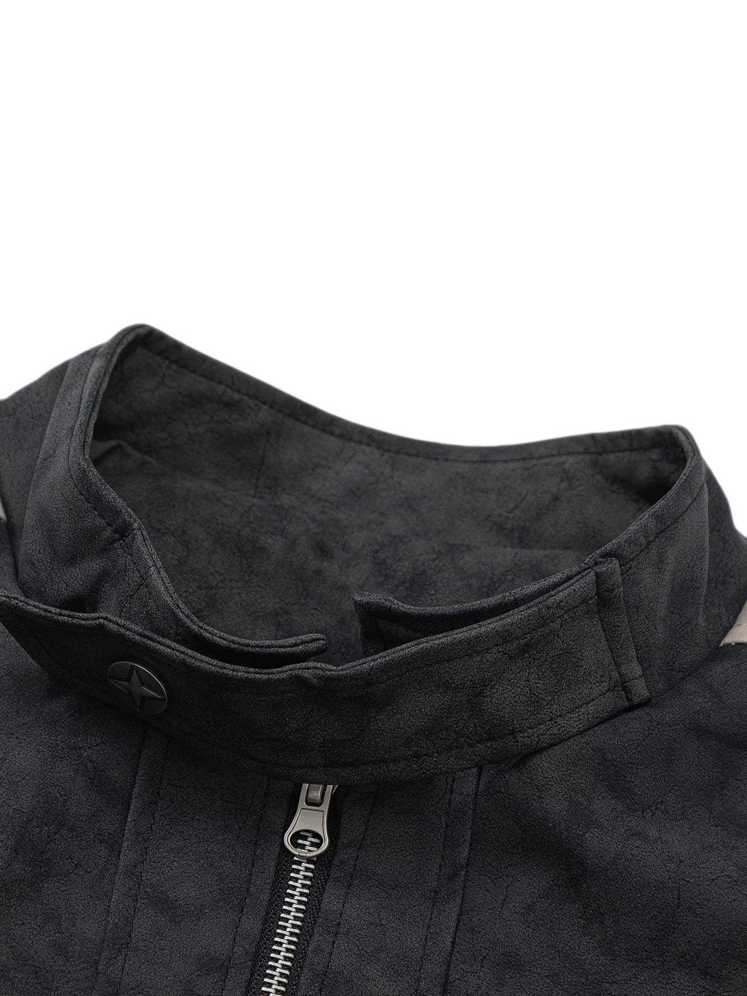 A close-up of the zipper and collar detail on a matte PU moto leather jacket by TALISHKO.