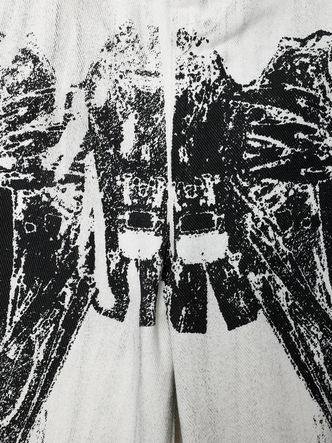 Detailed fabric and design of TALISHKO Mecha Print Jeans, highlighting bold robotic patterns.